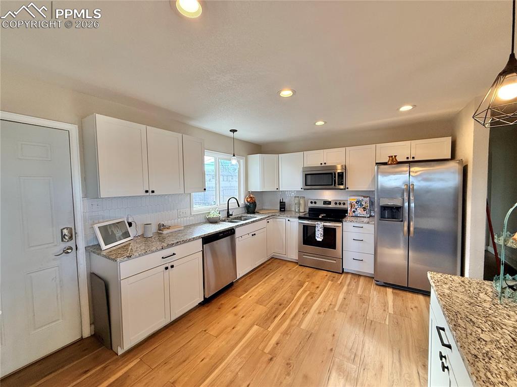 58 Duke Street Pueblo, CO 81005 - Photo 8 of 35 a kitchen with a sink stainless steel appliances and counter space