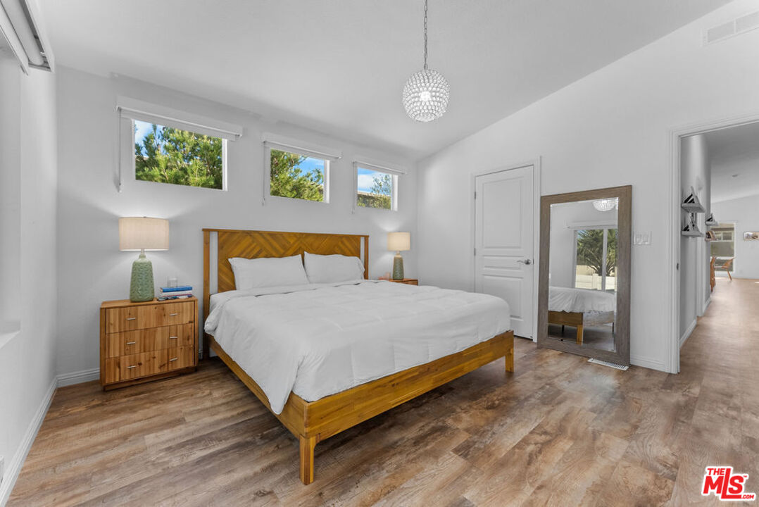 29500 Heathercliff Road, Unit 70 Malibu, CA 90265 - Photo 12 of 38 a bedroom with a bed and window