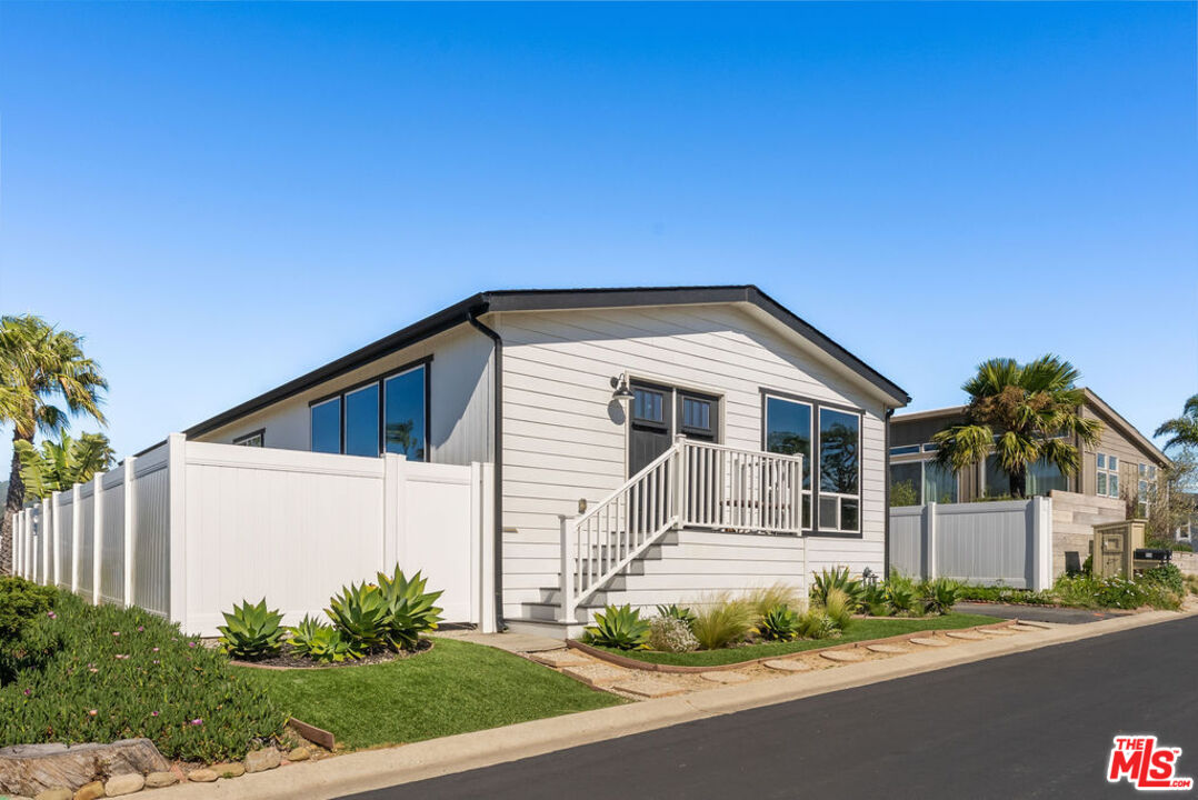 29500 Heathercliff Road, Unit 70 Malibu, CA 90265 - Photo 17 of 38 a front view of a house with a garage