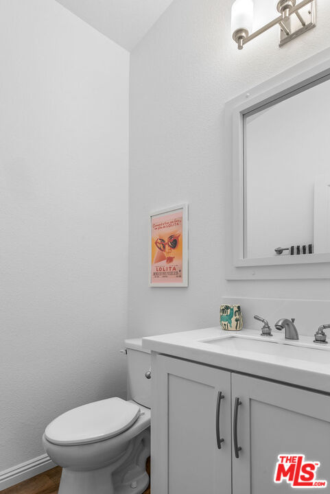 29500 Heathercliff Road, Unit 70 Malibu, CA 90265 - Photo 7 of 38 a bathroom with a sink a toilet and a mirror