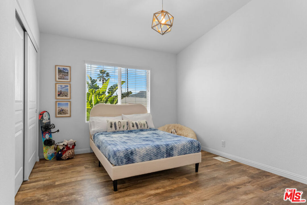 29500 Heathercliff Road, Unit 70 Malibu, CA 90265 - Photo 9 of 38 a bedroom with a bed and a window