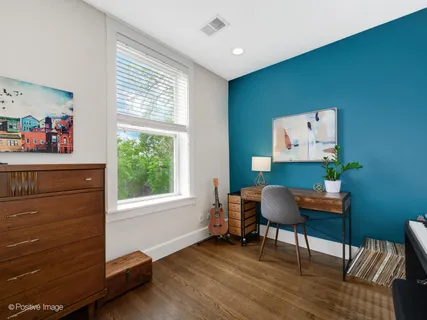 a workspace with furniture and a window