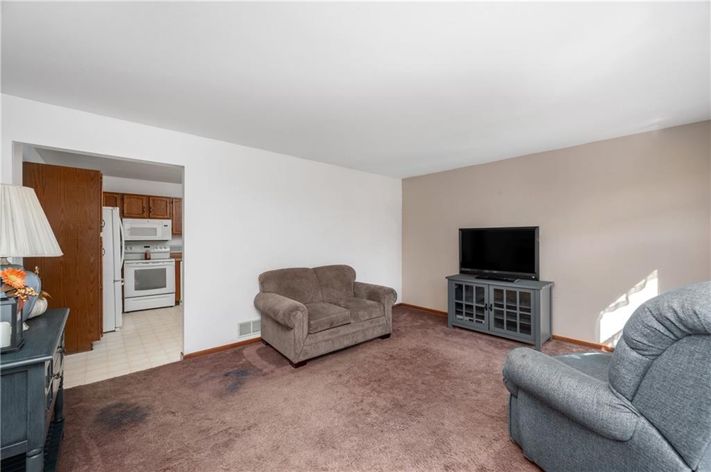 232 Pfeifer Road Harmony, PA 16037 - Photo 6 of 33 a living room with furniture and a flat screen tv