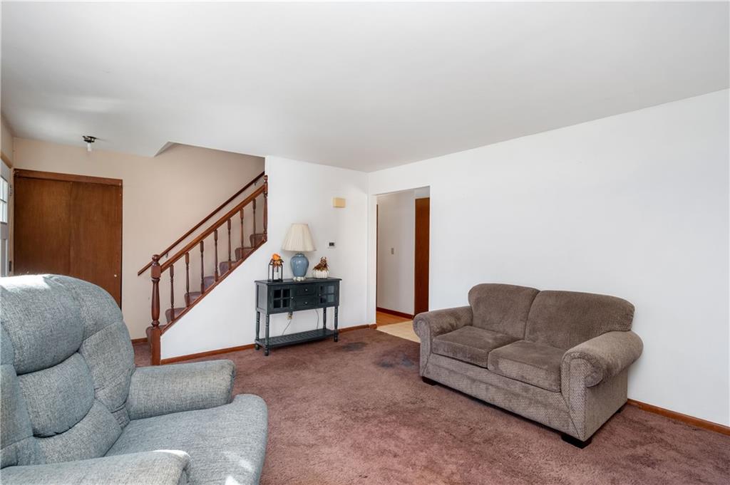 232 Pfeifer Road Harmony, PA 16037 - Photo 9 of 33 a living room with furniture and stairs