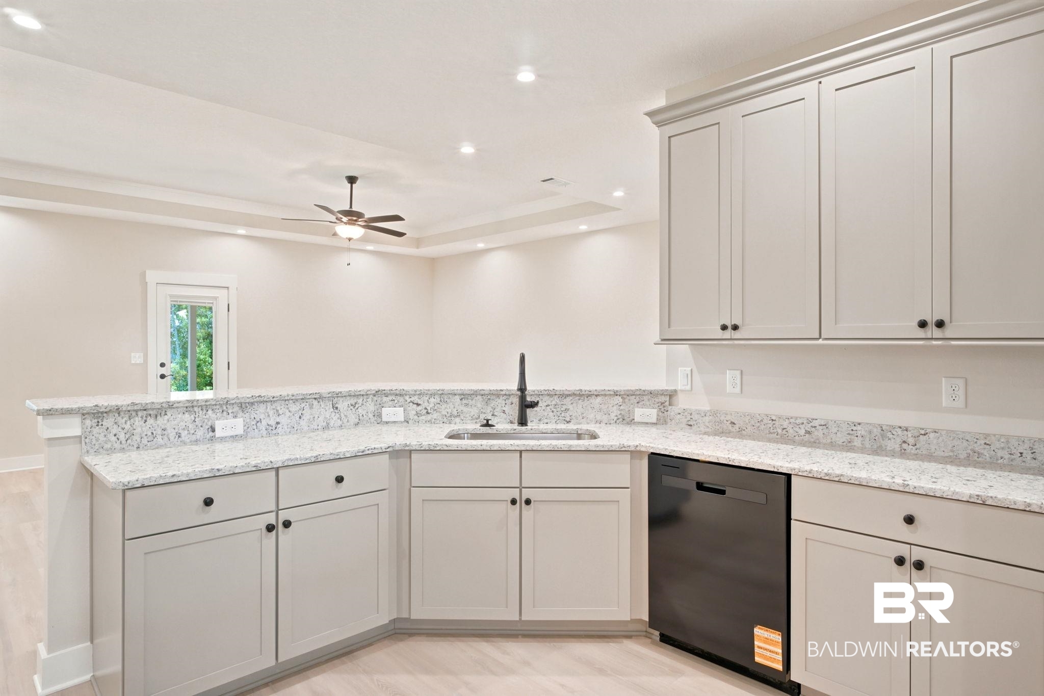 32656 Arbor Ridge Circle Lillian, AL 36549 - Photo 12 of 56 Kitchenette featuring light-toned cabinetry, speckled countertops, and a stainless steel sink with a matte black faucet