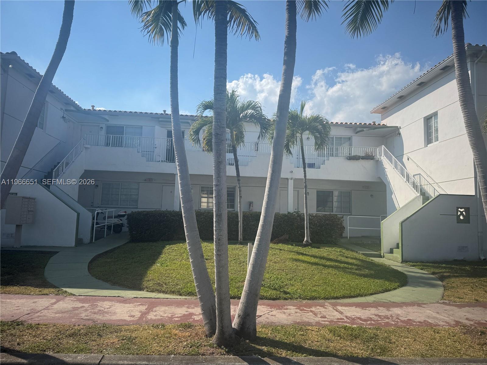 7130 Rue Versailles Drive, Unit 3 Miami Beach, FL 33141 - Photo 11 of 17 a view of a backyard