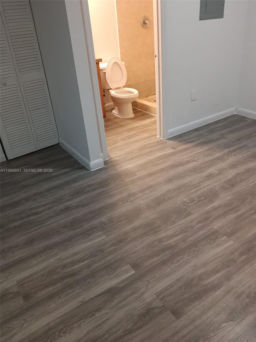 7130 Rue Versailles Drive, Unit 3 Miami Beach, FL 33141 - Photo 12 of 17 a view of a room and wooden floor