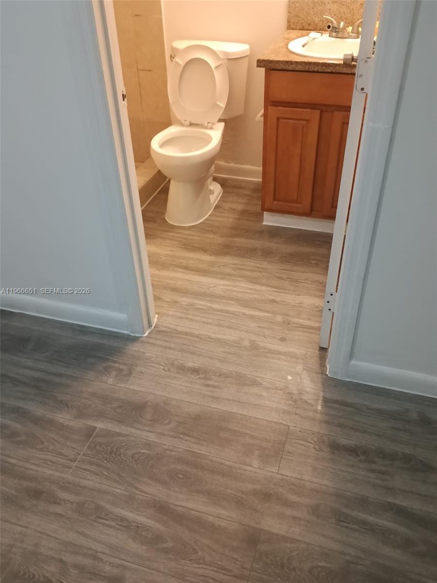 7130 Rue Versailles Drive, Unit 3 Miami Beach, FL 33141 - Photo 16 of 17 a large white room with a toilet
