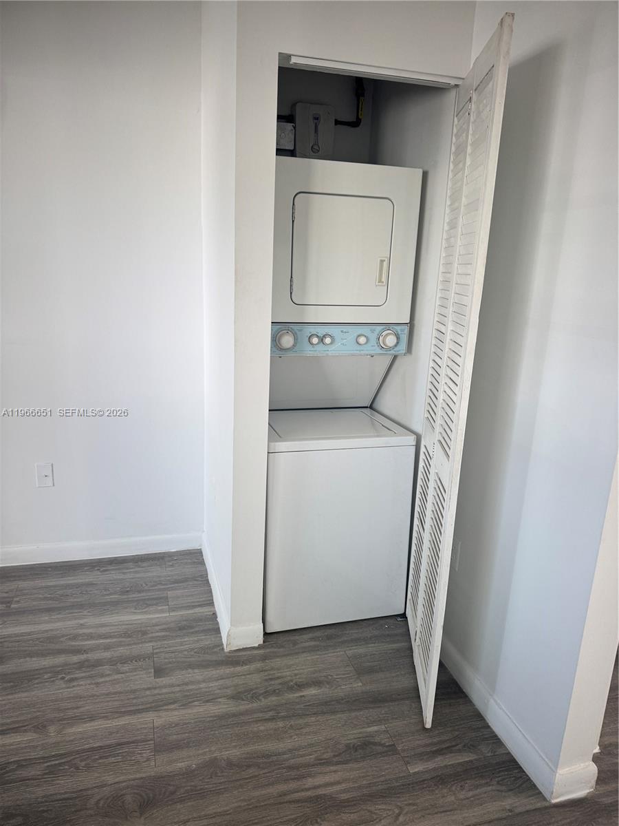 7130 Rue Versailles Drive, Unit 3 Miami Beach, FL 33141 - Photo 9 of 17 a utility room with a washer and dryer