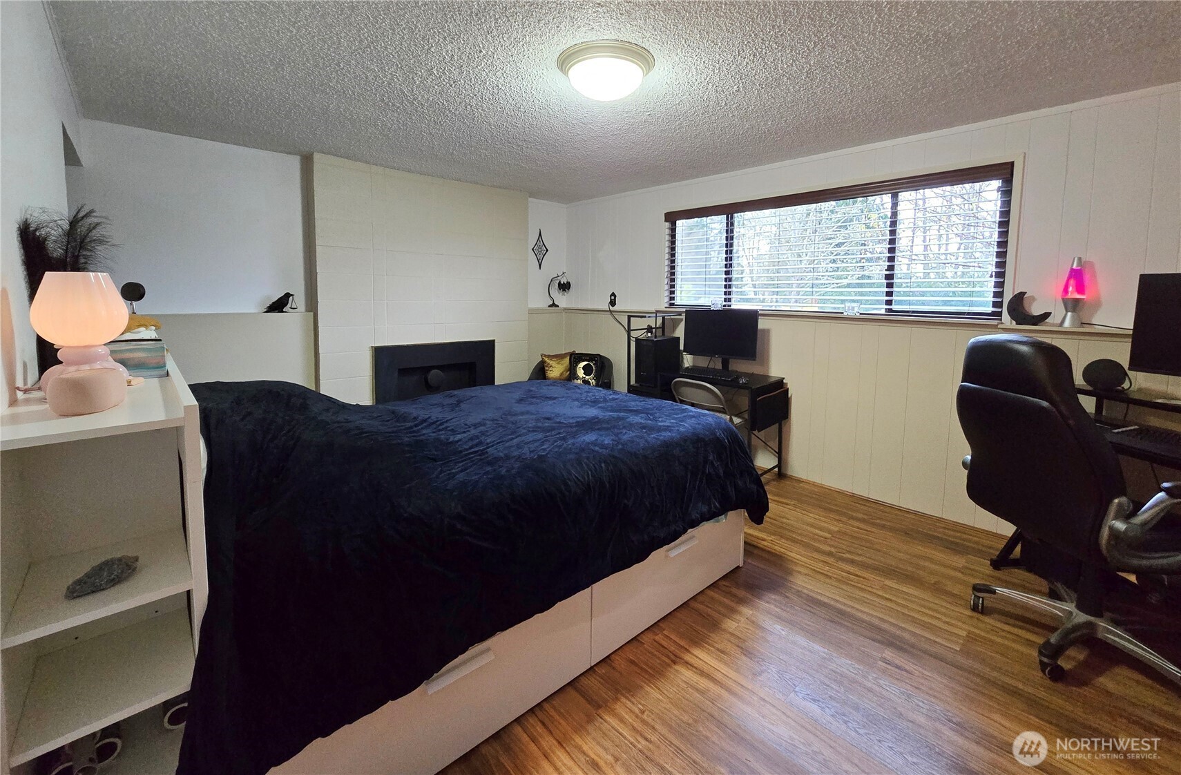 15 Kellogg Road Clallam Bay, WA 98326 - Photo 11 of 27 a bedroom with a bed and wooden floor