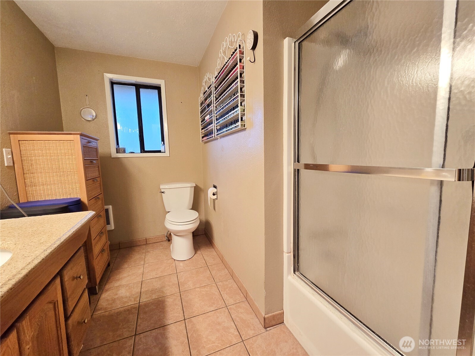 15 Kellogg Road Clallam Bay, WA 98326 - Photo 21 of 27 a bathroom with a sink a toilet and a shower