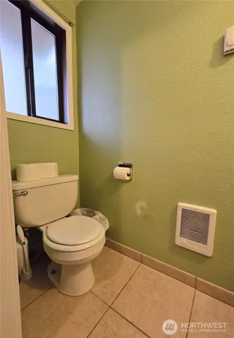 a bathroom with a sink mirror and vanity