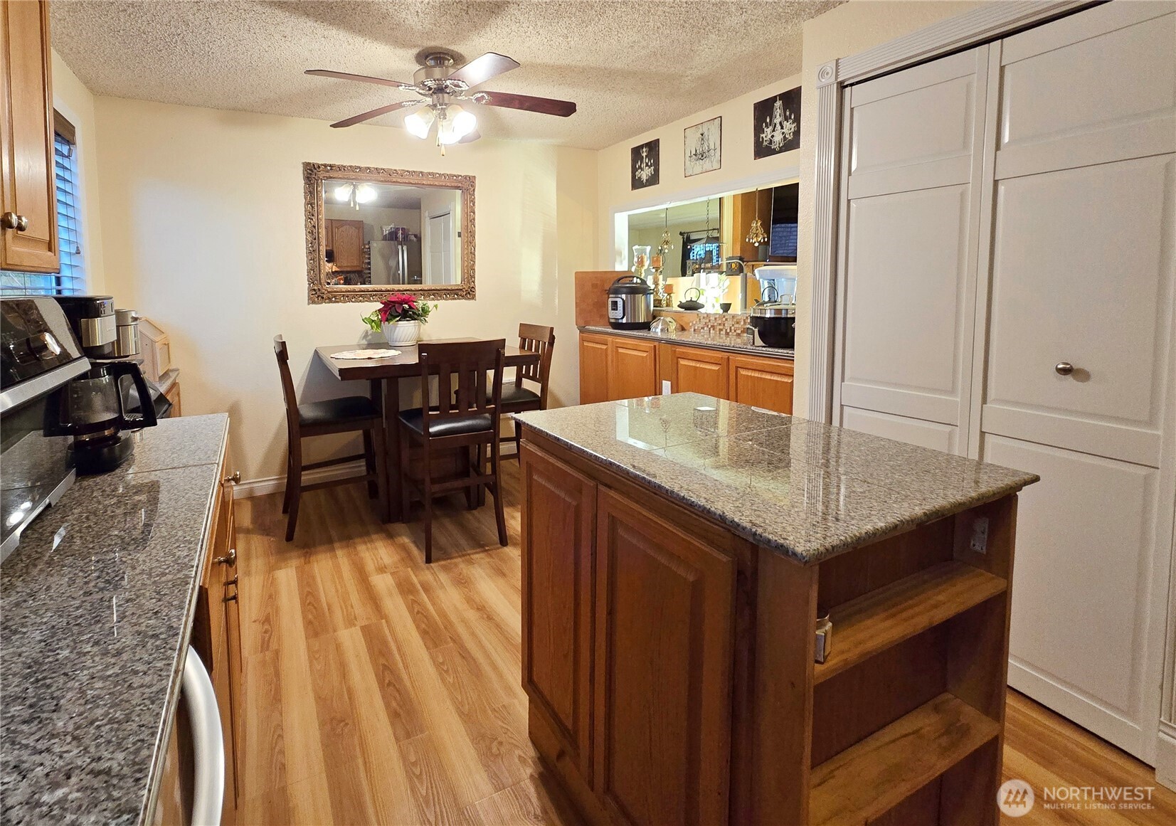 15 Kellogg Road Clallam Bay, WA 98326 - Photo 8 of 27 a living room with stainless steel appliances kitchen island granite countertop furniture and a dining table