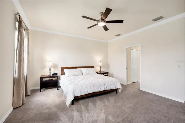 a bedroom with a bed and window