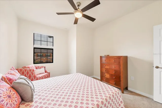 a bedroom with a bed and a dresser