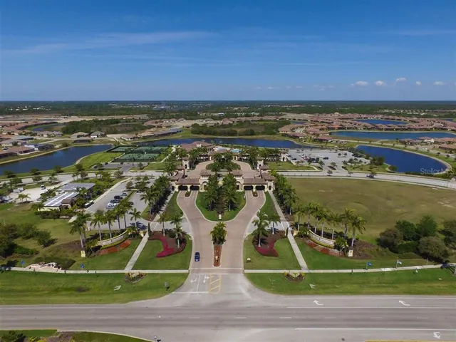 an aerial view of a houses with a yard