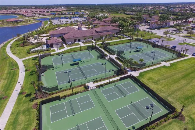 an aerial view of a house with a lake view