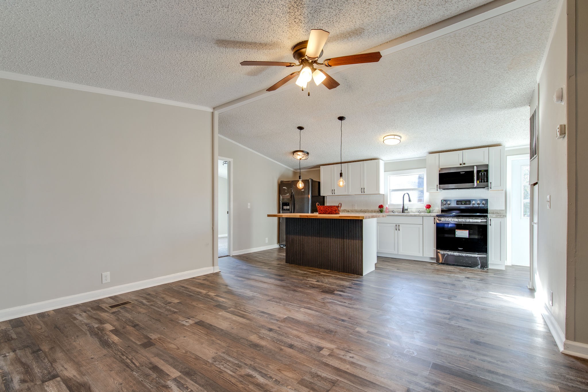 1158 East Ab Wade Road Portland, TN 37148 - Photo 7 of 29 a view of kitchen with cabinets and wooden floor
