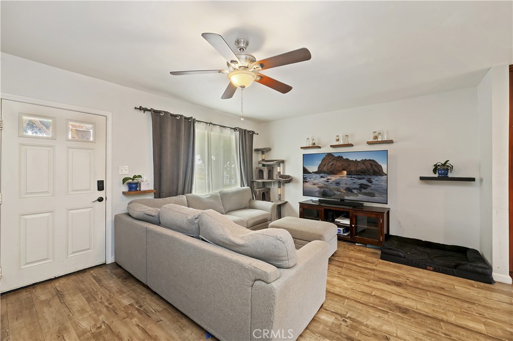 3075 Ronald Street Riverside, CA 92506 - Photo 7 of 30 a living room with furniture and a wooden floor