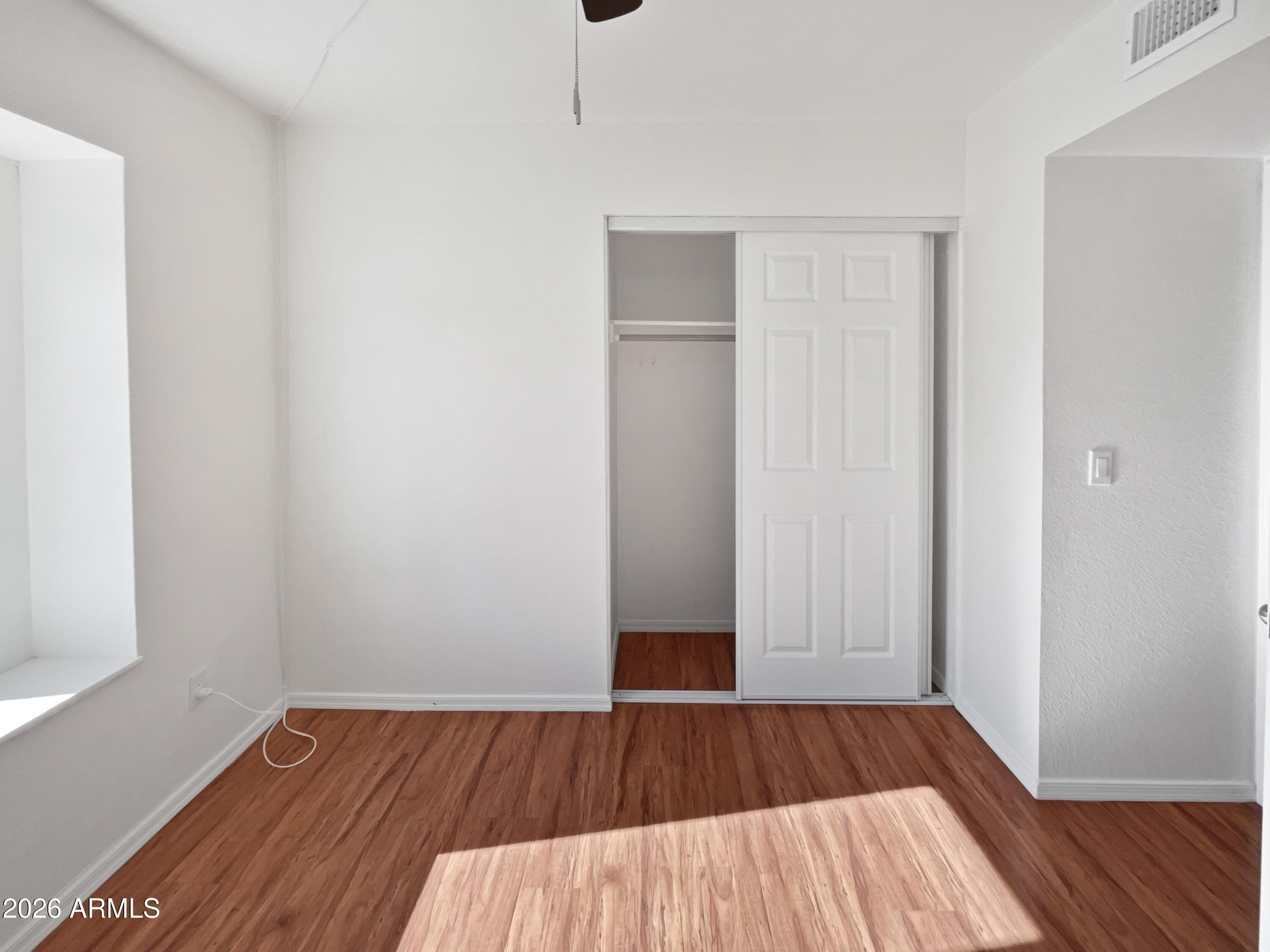 19002 North 14th Place Phoenix, AZ 85024 - Photo 12 of 27 a view of a room with wooden floor