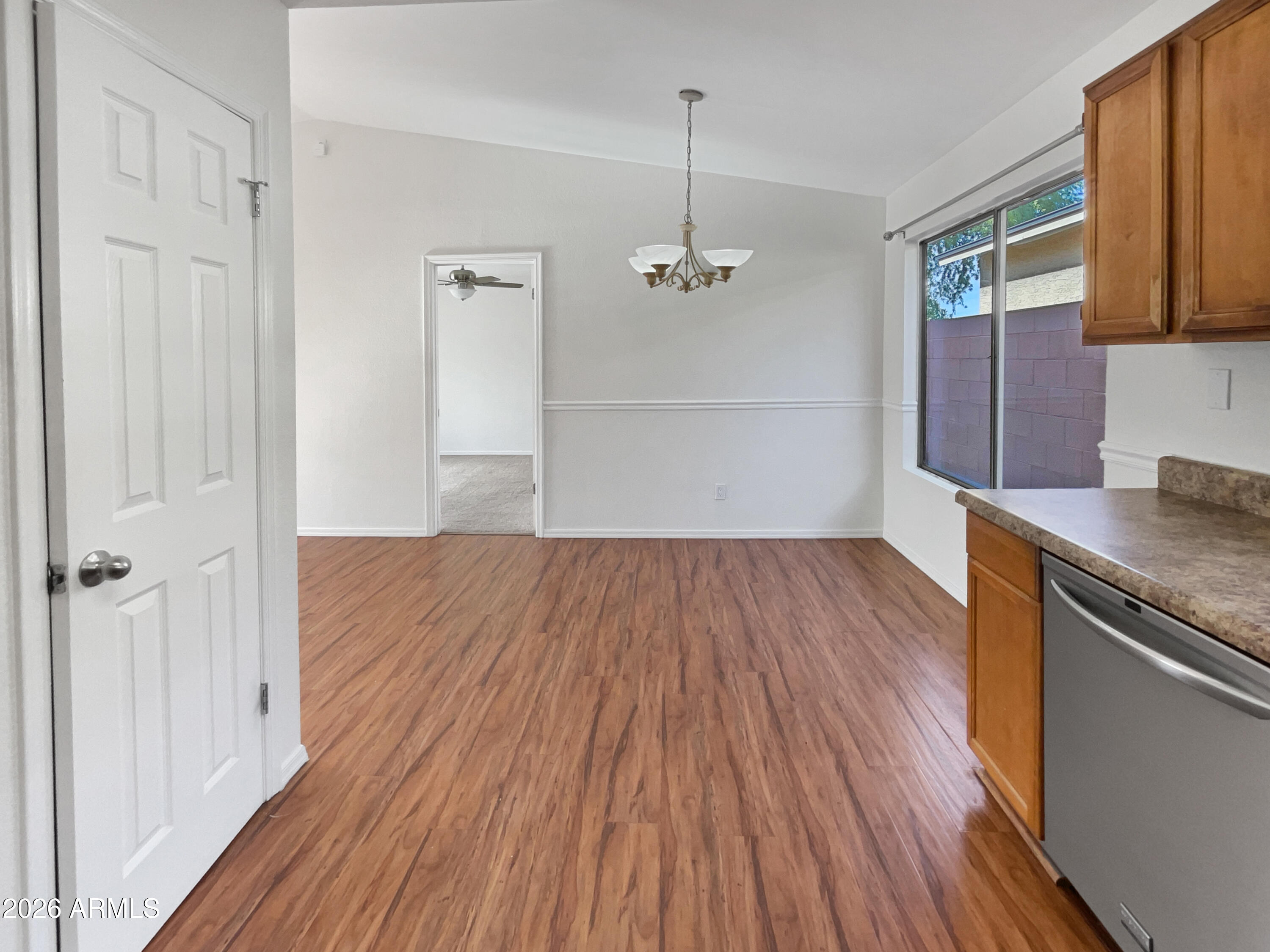 19002 North 14th Place Phoenix, AZ 85024 - Photo 19 of 27 wooden floor in an empty room with a window