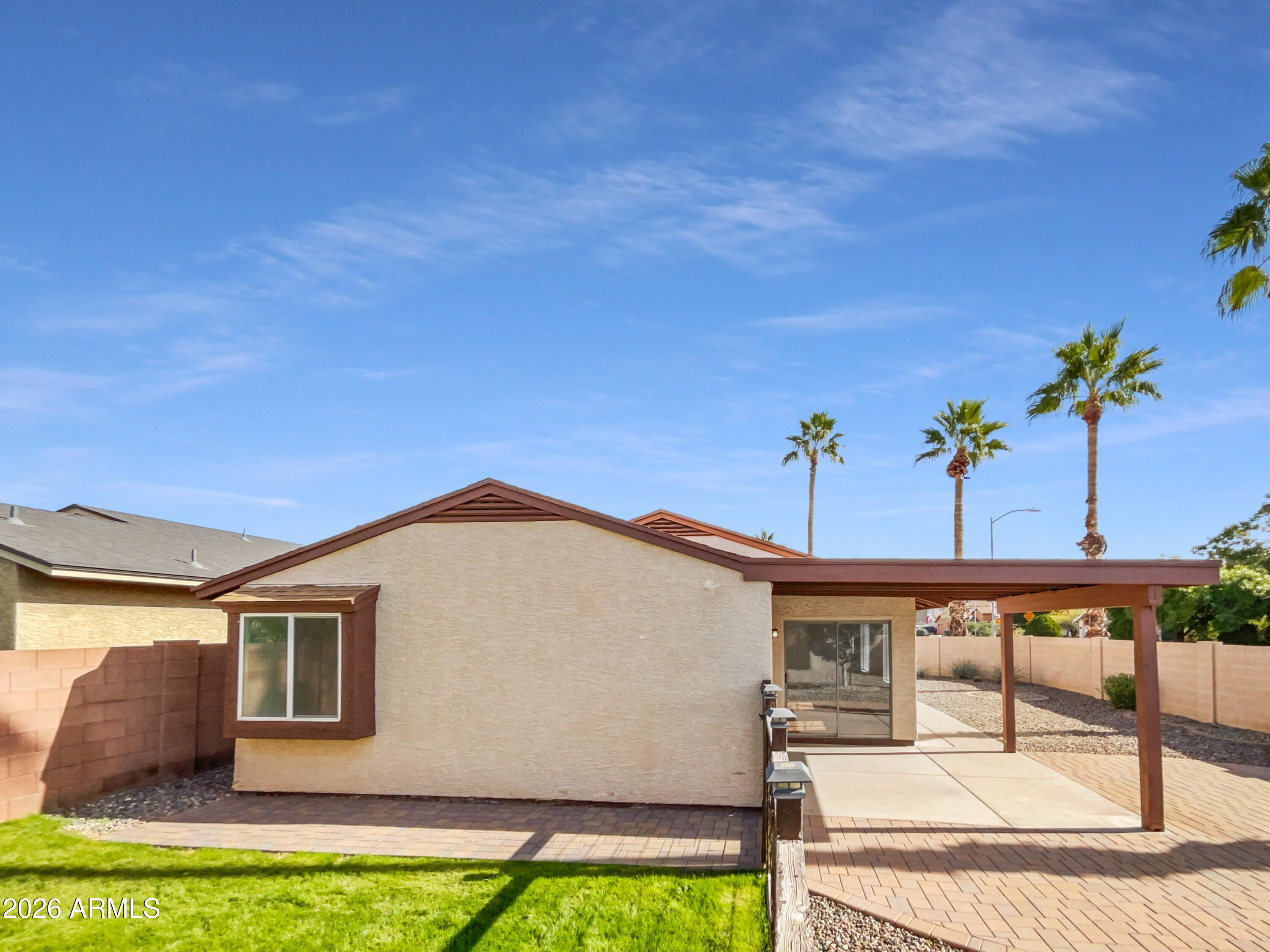 19002 North 14th Place Phoenix, AZ 85024 - Photo 26 of 27 a view of a house with a backyard and windows