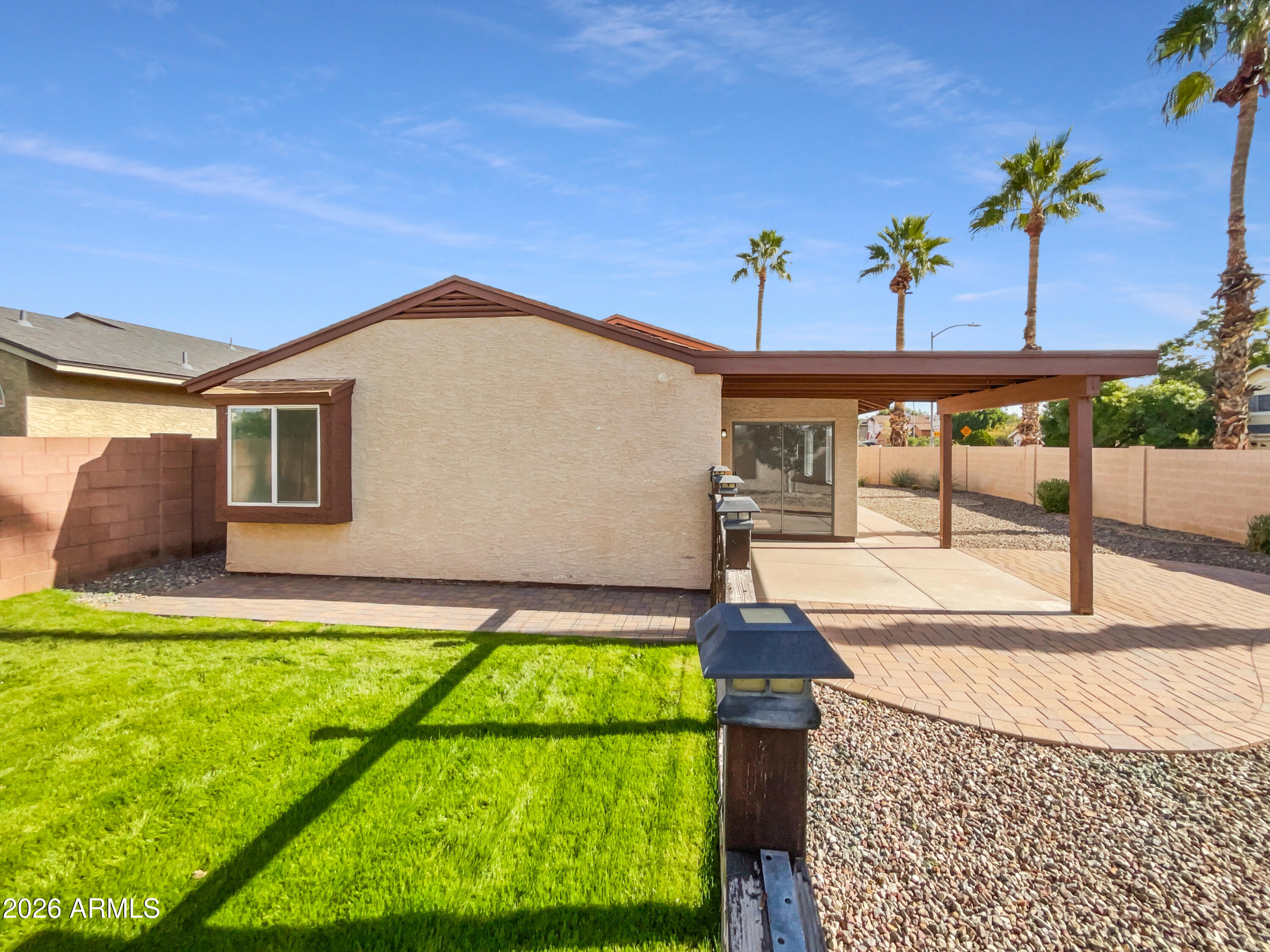 19002 North 14th Place Phoenix, AZ 85024 - Photo 5 of 27 a front view of a house with garden