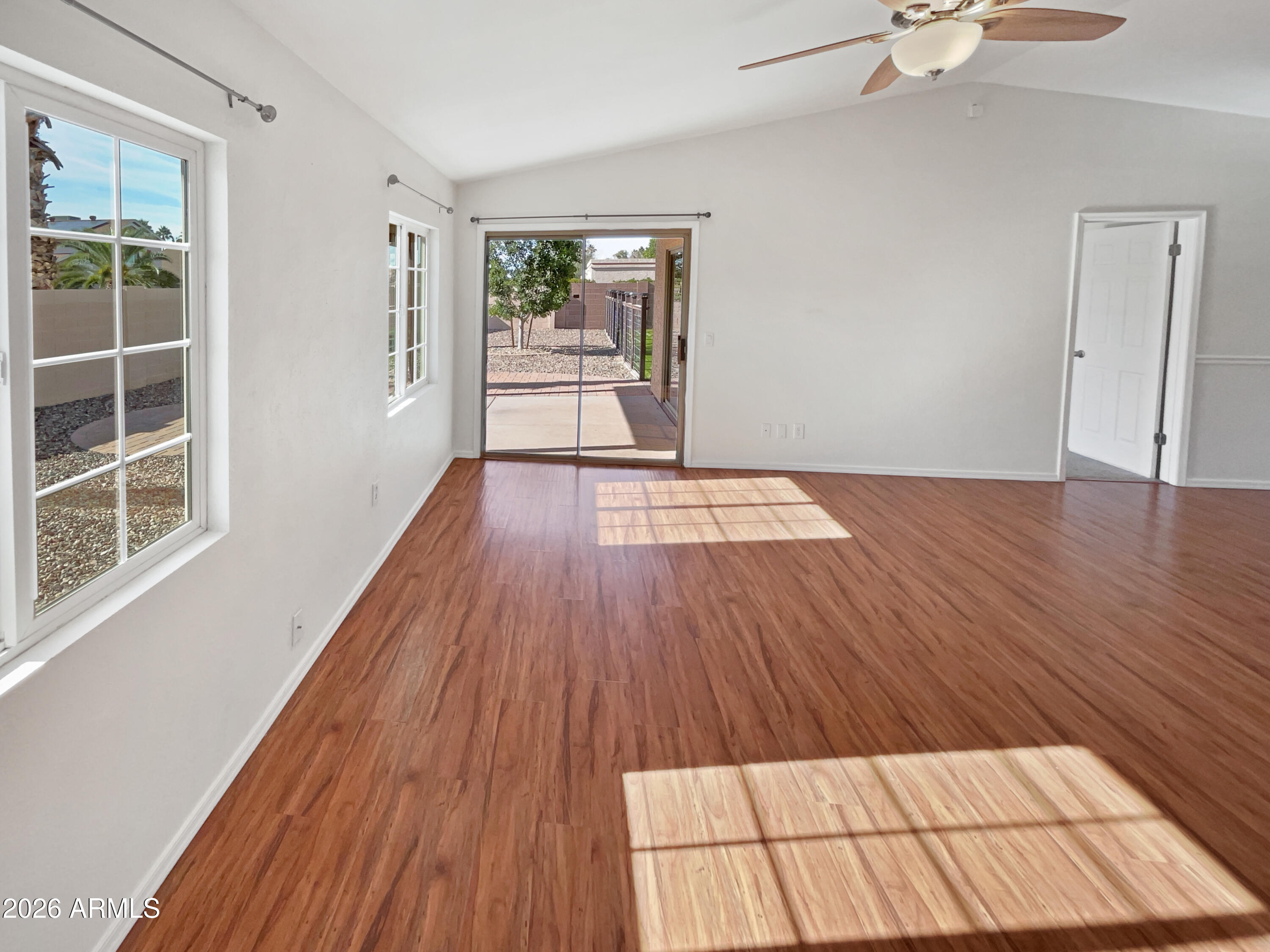 19002 North 14th Place Phoenix, AZ 85024 - Photo 8 of 27 wooden floor in an empty room with a window