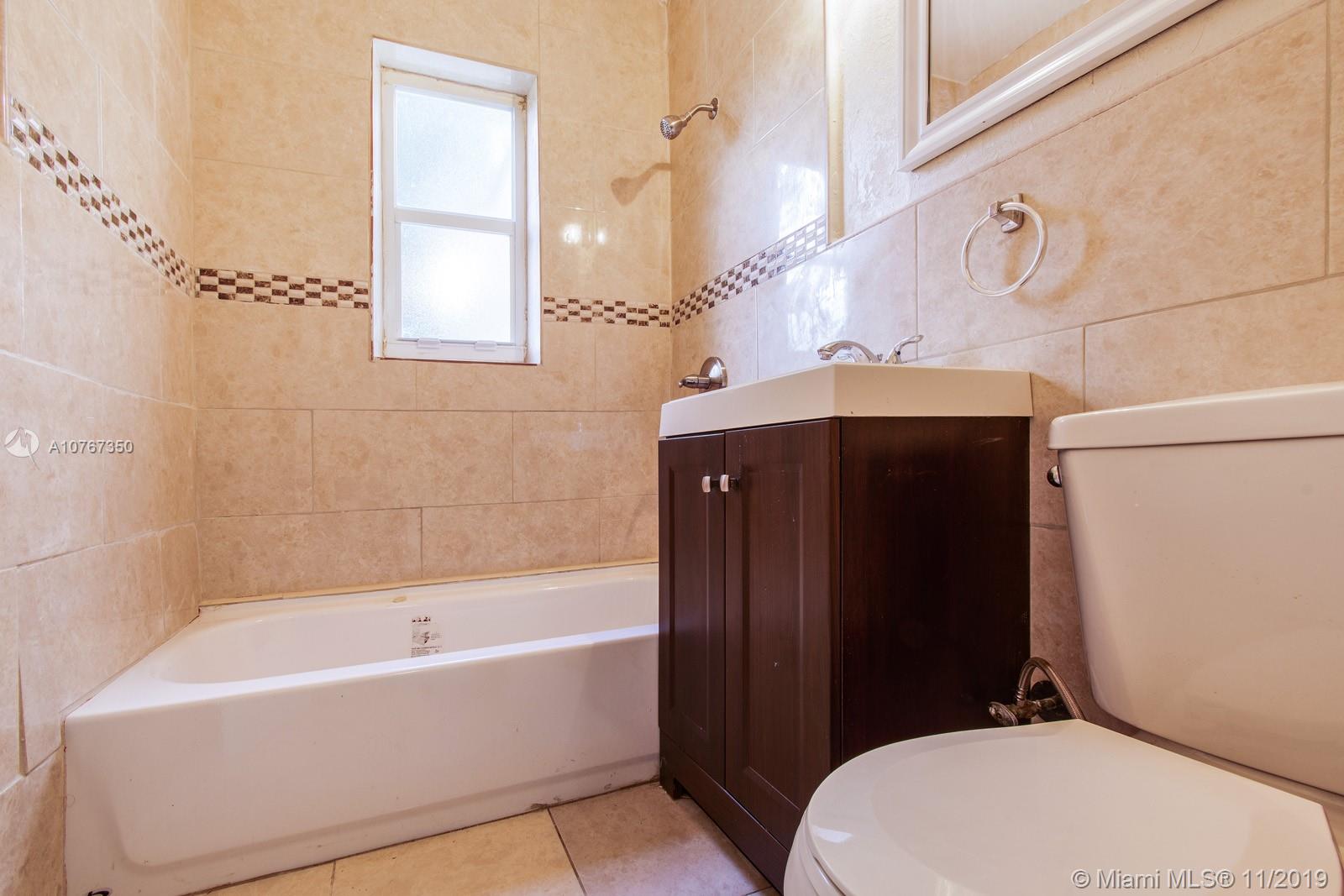 540 Northwest 119th Street Miami, FL 33168 - Photo 4 of 10 Updated bathroom