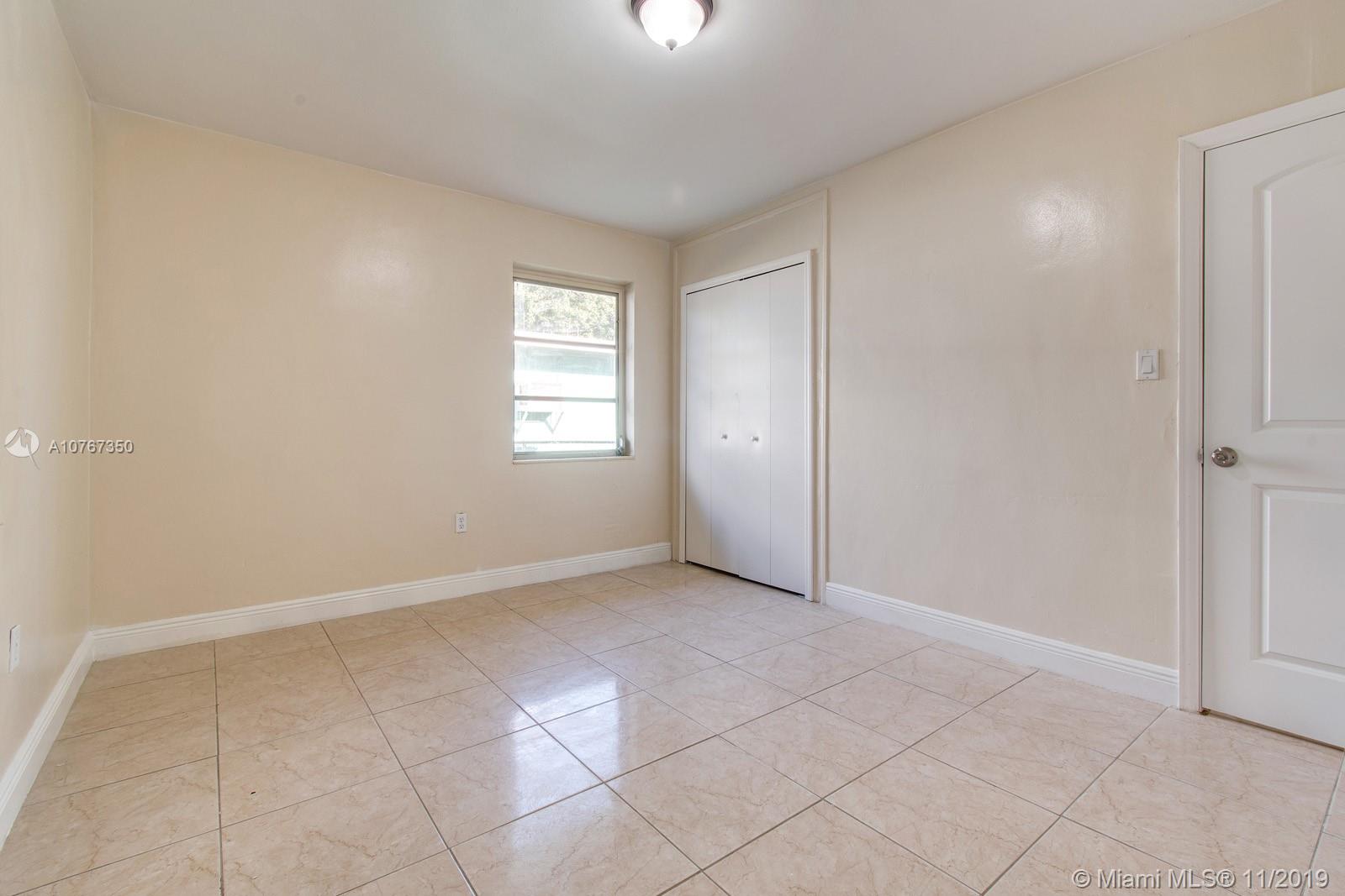 540 Northwest 119th Street Miami, FL 33168 - Photo 7 of 10 Master bedroom