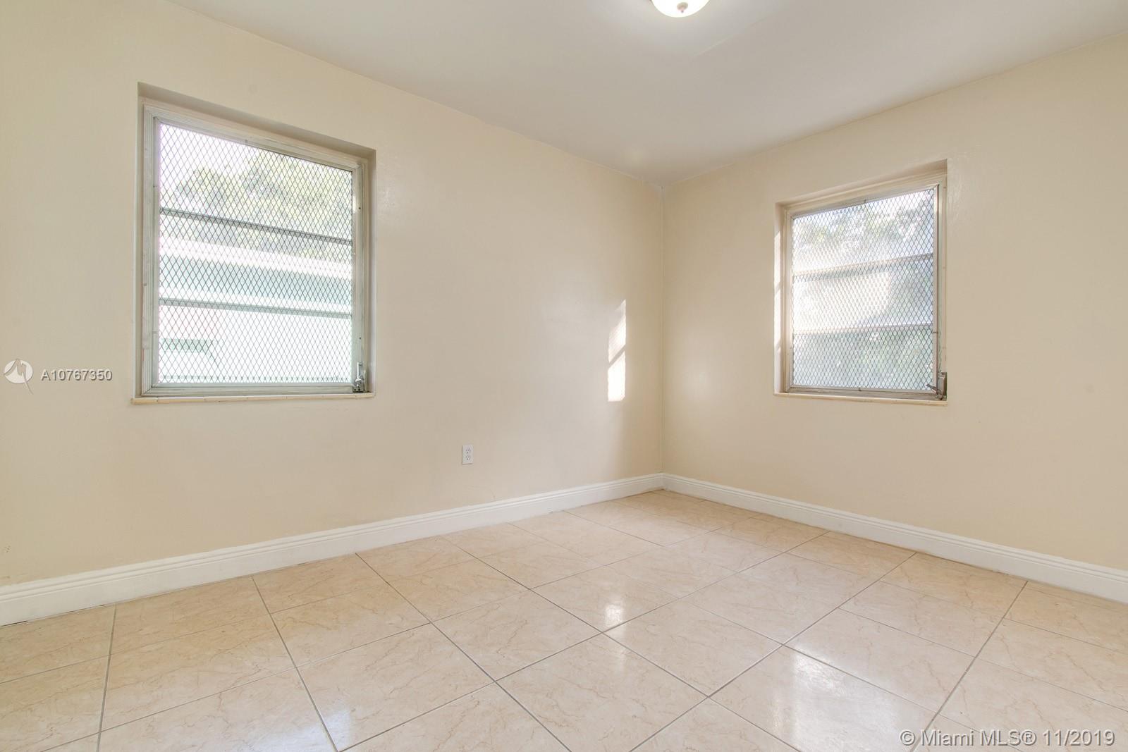 540 Northwest 119th Street Miami, FL 33168 - Photo 8 of 10 Back bedroom