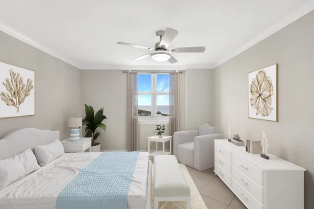 a living room with furniture and a potted plant