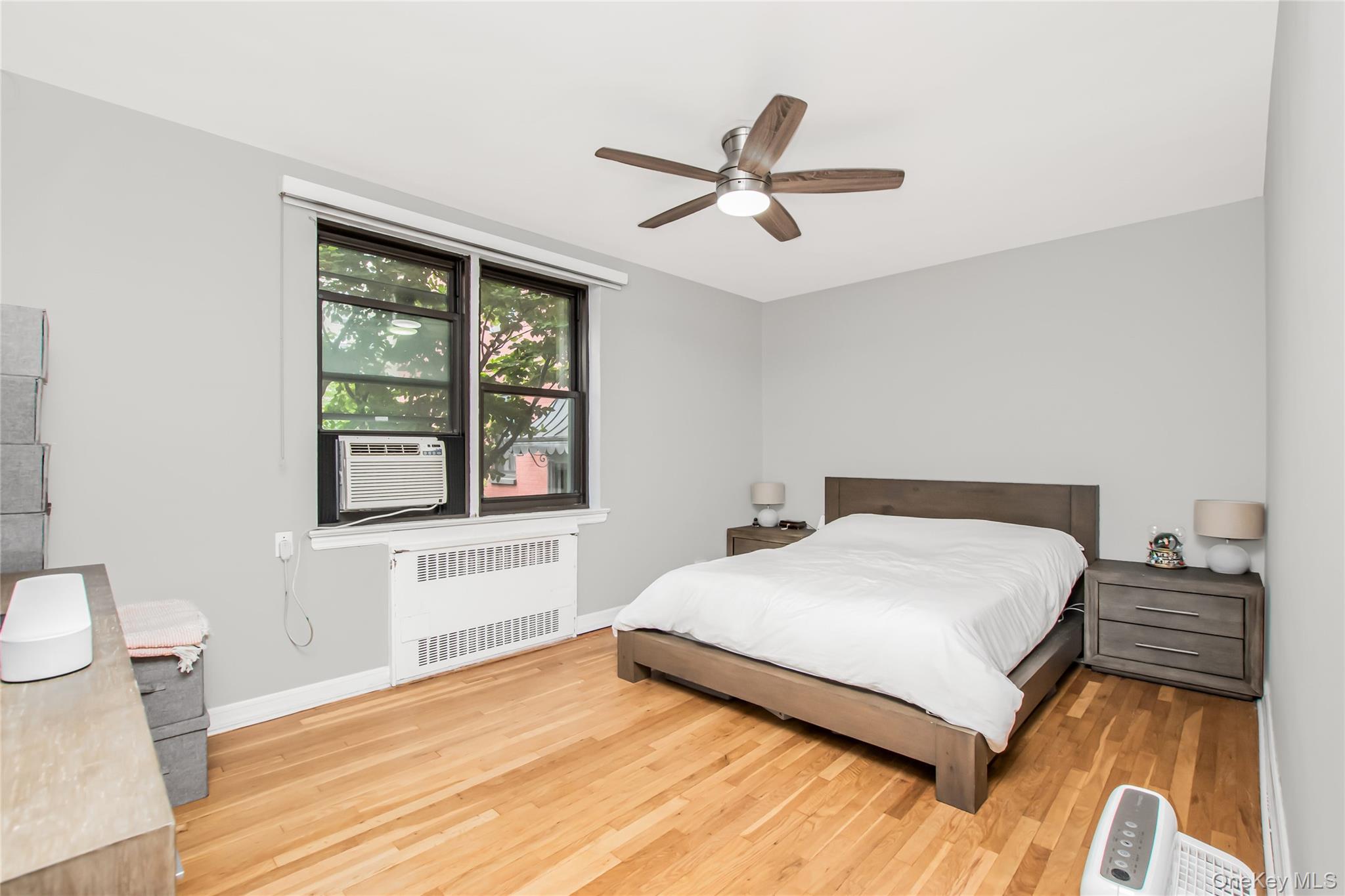 512 Kappock Street, Unit 1K Bronx, NY 10463 - Photo 7 of 11 a bedroom with a bed and a window