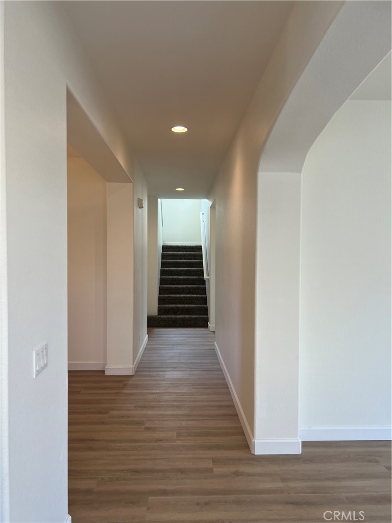 12772 Clemson Drive Eastvale, CA 92880 - Photo 13 of 28 a view of entryway with wooden floor