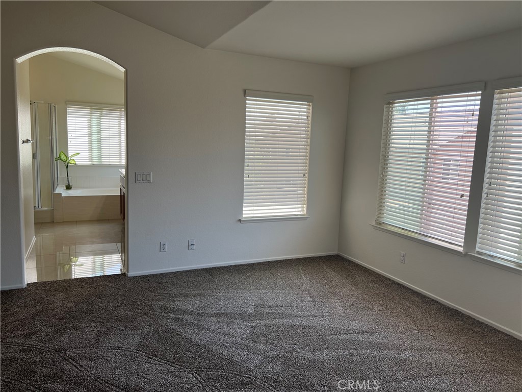 12772 Clemson Drive Eastvale, CA 92880 - Photo 16 of 28 an empty room with windows and closet