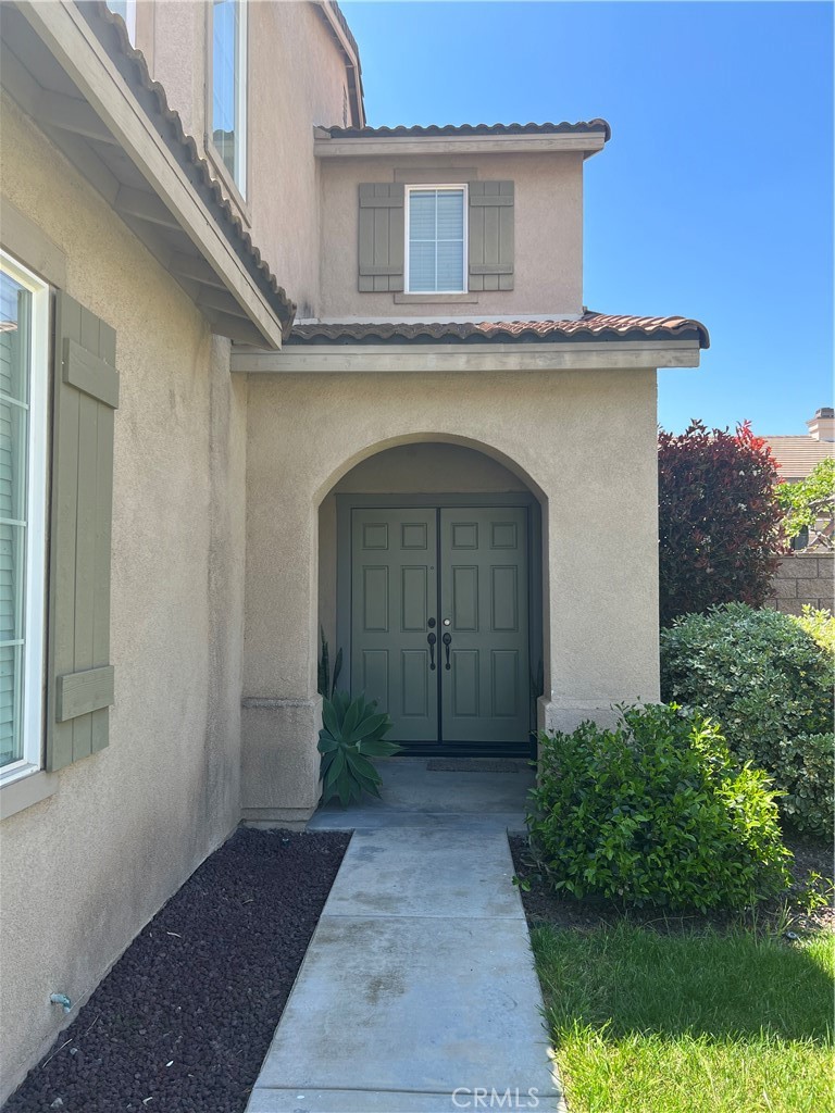 12772 Clemson Drive Eastvale, CA 92880 - Photo 2 of 28 a view of front door and small yard