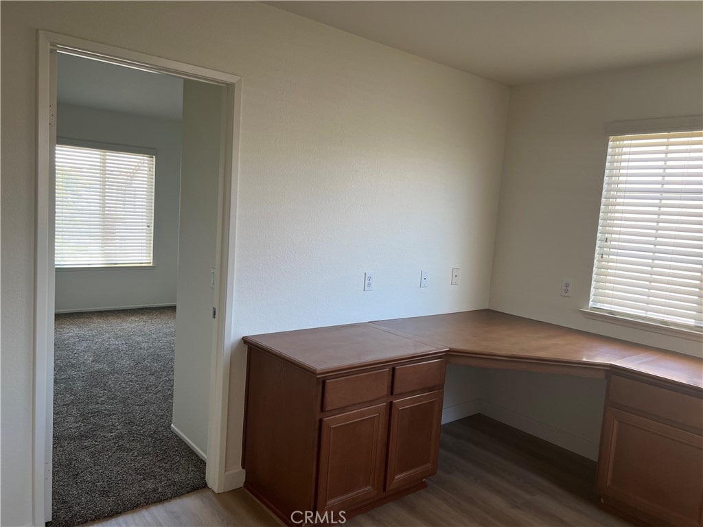 12772 Clemson Drive Eastvale, CA 92880 - Photo 22 of 28 a room with cabinets and a window