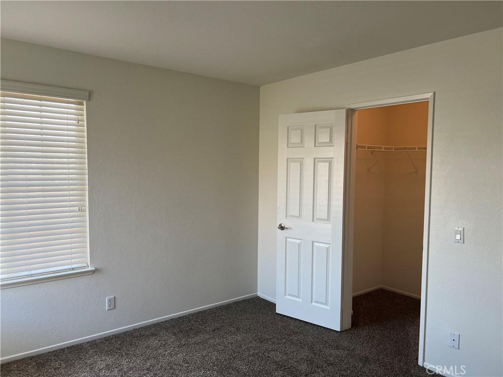 12772 Clemson Drive Eastvale, CA 92880 - Photo 24 of 28 an empty room with windows