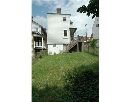 2820 Spring Street Pittsburgh, PA 15210 - Photo 10 of 10 Exterior Back. Rear enterance to apartment duplex w/ lovely fenced back yard