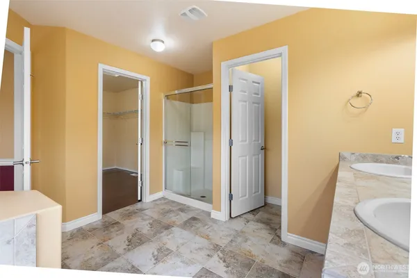a view of a bathroom from a hallway