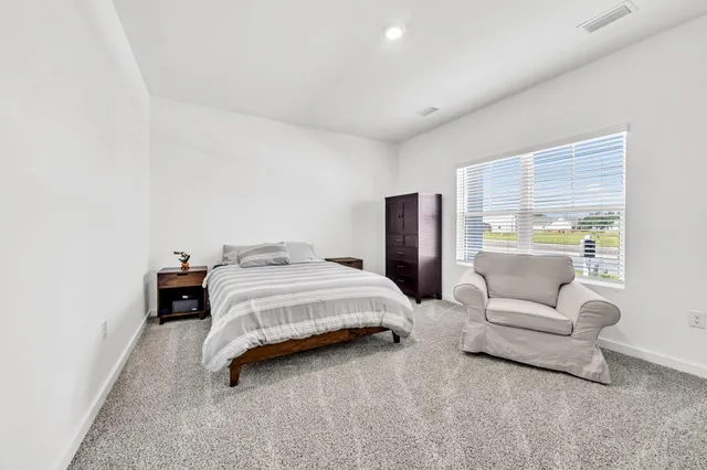 a bedroom with a bed and a closet