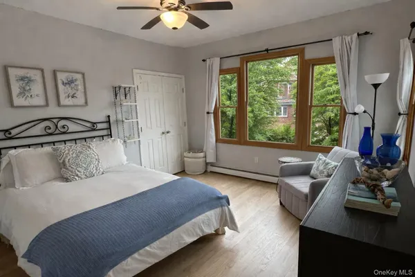 a bedroom with a bed and a couch