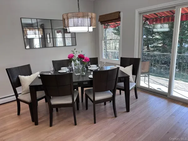 a view of a dining room with furniture window and outside view