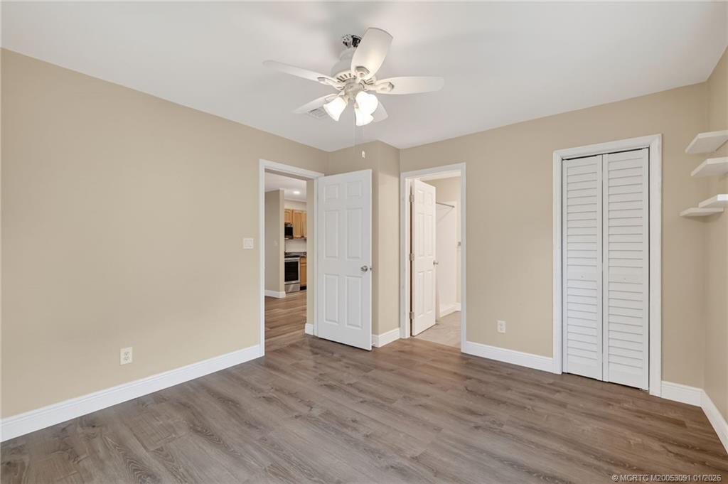 607 Southeast Cortez Avenue Stuart, FL 34994 - Photo 21 of 29 a view of an empty room with wooden floor