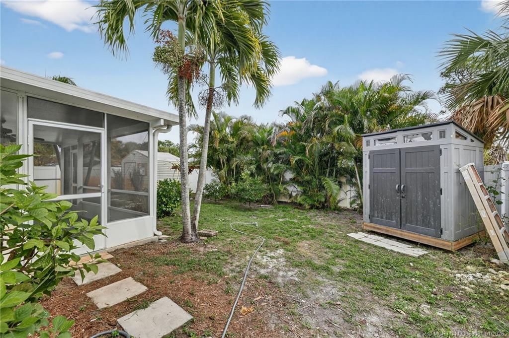 607 Southeast Cortez Avenue Stuart, FL 34994 - Photo 27 of 29 a view of a house with a backyard