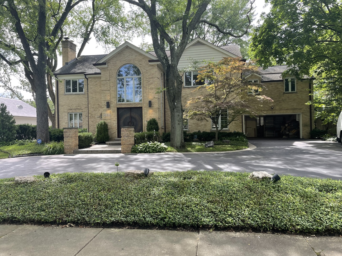 1046 Bluff Road Glencoe, IL 60022 - Photo 1 of 1 front view of a house with a yard