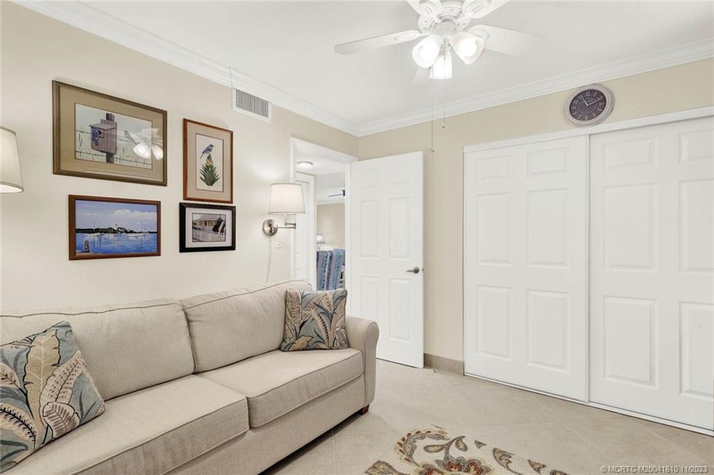 1950 Southwest Palm City Road, Unit 4107 Stuart, FL 34994 - Photo 33 of 65 a living room with furniture and a ceiling fan