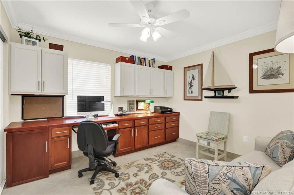 1950 Southwest Palm City Road, Unit 4107 Stuart, FL 34994 - Photo 34 of 65 a view of a workspace with furniture and a window