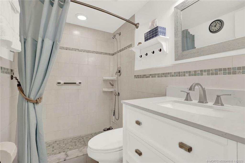 1950 Southwest Palm City Road, Unit 4107 Stuart, FL 34994 - Photo 36 of 65 a bathroom with a sink a toilet and shower
