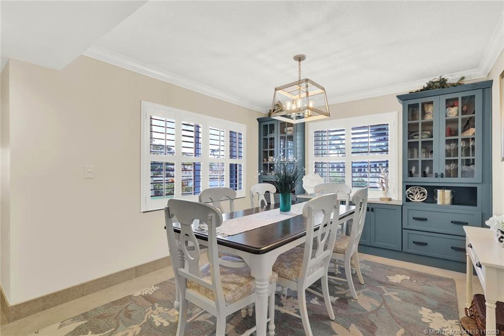 1950 Southwest Palm City Road, Unit 4107 Stuart, FL 34994 - Photo 8 of 65 a view of a dining room with furniture window and outside view